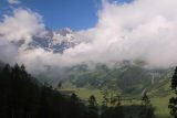 Grossglockner_041_07112018 - Looking towards a partial view of the alpine peaks facing north shrouded by some clouds with an interesting cascade below as seen from the Grossglockner Road