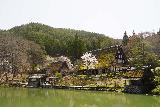 Hida_no_Sato_007_04122023 - Looking across the initial pond towards some of the Gassho-style houses within Hida no Sato in Takayama