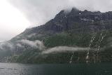 Hurtigruten_day2_242_06302019 - Direct look at waterfalls coming down tall mountains in Geirangerfjorden