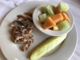 Jackson_Lake_Lodge_005_iPhone_08132017 - Tahia's paltry lunch dish of grilled chicken and a pickel with fruit cup at the Jackson Lake Lodge