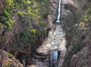 Double Falls was a bit of a waterfall surprise for us as it ended up being included as part of our air tour over both Twin Falls.  It was an attractive two-tiered waterfall that drained into the...