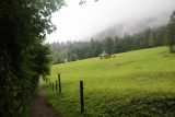 Josefstaler_Waterfall_098_06282018 - Looking towards some farms and grassy pastures under the rain on the shortest trail to the Josefstaler Waterfalls