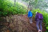 Kamuiwakka_014_07172023 - Josh and Mom going up the slippery initial slope immediate after the trailhead of the Kamuiwakka Falls