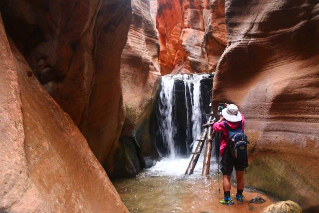 Mom in a pair of canyoneering shoes that were well-suited for water-based adventures like this one in Utah