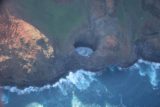Kauai_Inter_Island_heli_308_12272006 - A sinkhole or arch (depending on how you look at it) on Na Pali Coast
