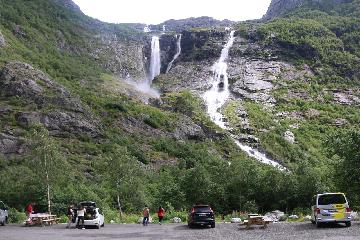 Krunefossen was a gushing waterfall at the terminus of the Krunebreen arm of the vast Jostedalsbreen Glacier. According to my Norgeskart measurements, the entire waterfall lost about 480m in...