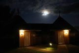 Koulnoue_Village_027_11252015 - Looking over our bungalow (joint with another guest's) with a full moon rising into the clouds in the background