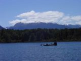 Lake_Te_Anau_003_11262004 - Looking across Lake Te Anau towards another boat chilling out in the deep lake backed by snow-capped mountains as we were making our way to the start of the Milford Track