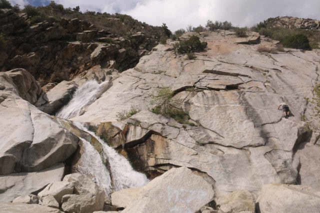 Lisa_Falls_047_05262017 - Context of Lisa Falls and an abseiler climbing alongside its granite-like cliff face
