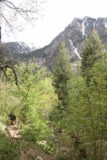 Lisa_Falls_057_05262017 - Context of a guy scrambling up towards Lisa Falls with the peaks flanking Little Cottonwood Canyon in the background