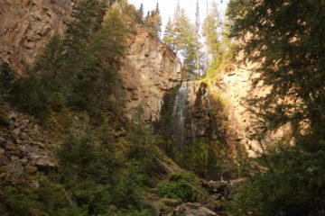 Lost Creek Falls was a light-flowing 40ft waterfall that sat quietly in a shadowy forest and mini-canyon right behind the Roosevelt Lodge.  Its wispy flow suggested...