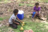Louniel_155_11262014 - The kids chopping out the husk of a coconut with a machete