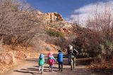 Lower_Calf_Creek_Falls_18_019_04022018 - Julie and the kids walking the first 300 yards from the day use parking lot through parts of the campground, and then eventually to the trailhead register en route to Lower Calf Creek Falls during our April 2018 visit