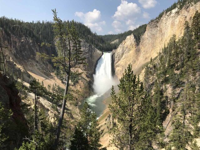 Julie using my iPhone to take this picture of the Lower Falls of the Yellowstone River (though it's not from the exact spot as the above photo so it's not a total apples-to-apples comparison)