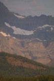 Many_Glacier_Hotel_045_08072017 - Zoomed in portrait look at some waterfalls beneath glaciers and mountains well beyond Swiftcurrent Lake's far western end