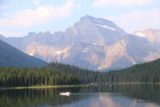 Many_Glacier_Hotel_052_08072017 - Looking towards some people on a boat on Swiftcurrent Lake with attractive mountains in the background