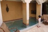 Marrakech_020_05152015 - Tahia checking out the little pool at the courtyard of Riad Lorsya