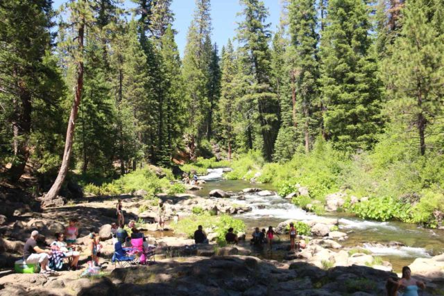 McCloud_Falls_040_06192016 - People sitting on lawn chairs enjoying a picnic and refreshments upstream from the Lower McCloud Falls