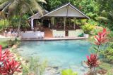 Mele_086_11282014 - Looking across a pretty blue and clear pool towards a reggae-blasting bar at Mele Cascades