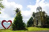 Merizo_Bell_Tower_010_11212022 - Another look at the combination of the red heart fronting the Merizo Bell Tower around the south of Guam