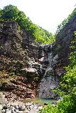 Miin_Pokpo_079_06142023 - Miin Pokpo Falls flanked by tall cliffs with a bit of a purplish gray tinge to them