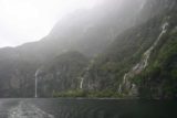 Milford_Sound_083_12242009 - Looking back towards part of Fairy Falls and Bridal Veil Falls while cruising the Milford Sound in late December 2009