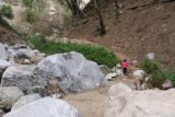 Millard_Falls_16_044_01302016 - Tahia getting across this very easy crossing amongst some big boulders on the waterfall trail