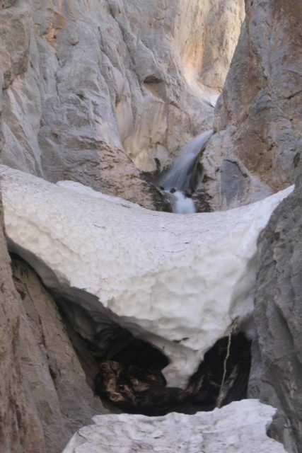 Mt_Charleston_429_04222017 - Close-up look at the Little Falls mostly covered in a snow chunk wedged between the narrowing gorge