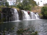Mumbuluma_Falls_004_jx_05292008 - The lower Mumbuluma Falls with a local kid jumping off of it