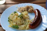 Munich_313_06292018 - This was the delicious gluten-free meal of potatos, sauerkraut, and a bratwurst at one of the food stalls we ate at in the Viktualienmarkt (I believe it was called Kleiner Ochsn'brater)