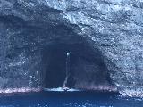 Na_Pali_Cruise_007_Julies_11212021 - A small boat motoring out of the Waiahuakua Sea Cave