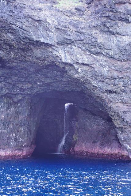 Waiahuakua Falls tumbling into the Waiahuakua Sea Cave