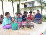 Nakavika_007_12262005 - Fijians gathering around a big kava bowl