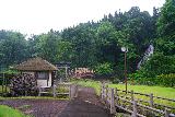 Nanataki_087_07102023 - Looking back at the context of the waterwheel, bridge, torii, and the Kosaka Nanataki Falls