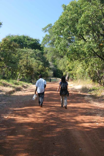 Ntumbachushi_Falls_004_05302008 - Julie and Joseph walking closer to the Ntumbachushi Falls in the reserve that Joseph manages
