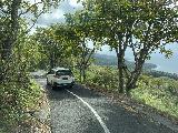 Nusa_Penida_098_iPhone_06252022 - Following a slower car on a narrow two-lane road along the east coast of Nusa Penida