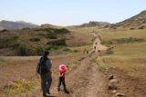 Paradise_Falls_007_04162016 - Julie and Tahia descending towards the unpaved road en route to the Mesa Trail further in the distance during our April 2016 hike