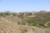 Paradise_Falls_034_04162016 - Looking in the other direction towards the suburban neighborhoods skirting the rim of Wildwood Canyon as seen from the North Teepee Trail in April 2016