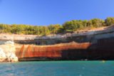 Pictured_Rocks_cruise_159_09302015 - A long line of red-streaked cliffs of the Pictured Rocks