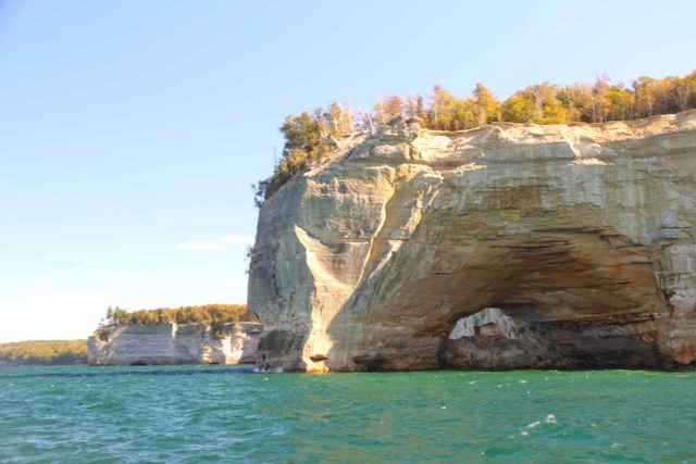 Pictured_Rocks_cruise_299_09302015 - Looking towards the remnants of a giant arch known as the Grand Portal Arch that was so big that sightseeing boats along the Pictured Rocks would go through it, but it collapsed in 1900