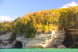 Pictured_Rocks_cruise_341_09302015 - Looking towards more dramatic Pictured Rocks underneath some trees exhibiting the start of some Fall colors