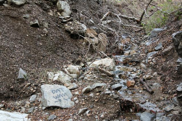 Placerita_Canyon_138_01192019 - Some jokester tagging this rock to try to mislead hikers to the wrong stream during our January 2019 visit.  This was at the convergence of two streams, which was unsigned, but it was just a couple of minutes from the end of the trail at the Placerita Creek Falls