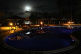 Poindimie_090_11262015 - Looking across the swimming pool at night towards the bright full moon in the distance