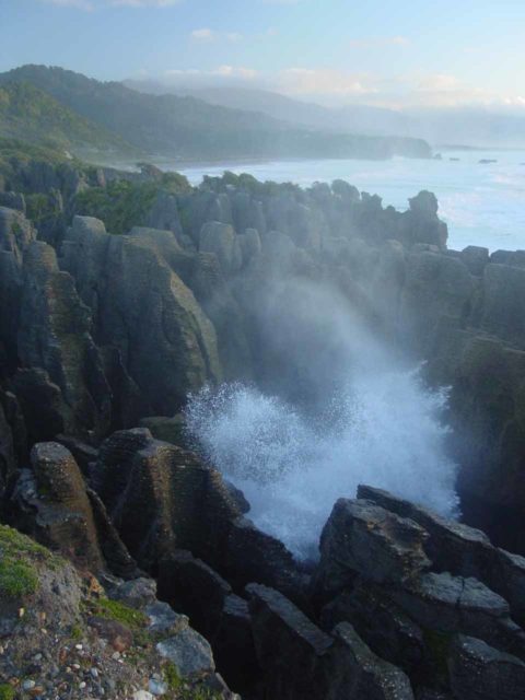 Punakaiki_044_11212004 - While waiting for the sunset under the bitterly cold weather at Pancake Rocks, the blowholes (like the Putai Blowhole shown here) powered by the raging seas kept us busy