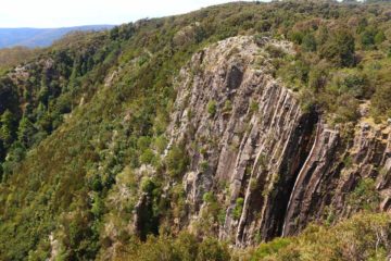 Ralphs Falls was a very tall but thin waterfall dropping 100m over a rugged cliff facing a wide open expanse of farmlands belonging to the community of Ringarooma. We were able to take in the falls...