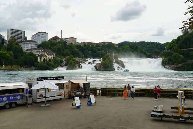 Rhine_Falls_167_06272025 - Context of some food trucks and lookouts on the Schlossli Worth side before the Rhine Falls