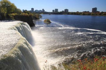 Rideau Falls was the other waterfall we visited while touring the capital city of Ottawa.  What made this waterfall (actually a pair of waterfalls) stand out in our minds was the view of downtown...