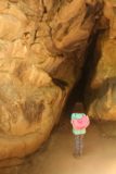 Rocky_Mouth_Falls_096_05262017 - Tahia looking at an opening of one of the caves near Rocky Mouth Falls, but she was afraid to go into the darkness