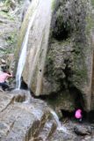 Rose_Valley_Apr_17_030_04022017 - Tahia crawling into one of the two entrances to the cave behind Rose Valley Falls in April 2017