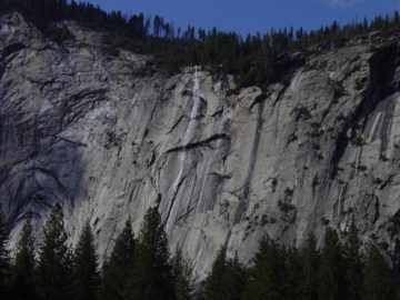 Tumbling near the Ahwahnee Hotel lies the stringy Royal Arch Cascades. Distracted by the Royal Arches, the Washington Column, and North Dome, visitors often fail to notice this streaking waterfall...